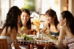 Asia Images Group - Group of young women, sitting down at cafe, talking
