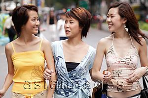 Asia Images Group - Friends walking side by side, talking