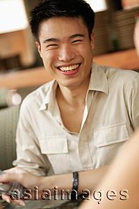 Asia Images Group - Young man smiling, portrait