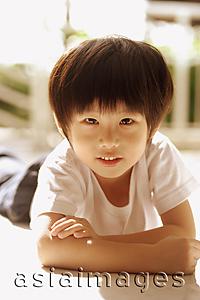 Asia Images Group - Young boy looking at camera, arms crossed