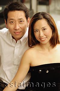 Asia Images Group - Well dressed couple looking at camera, portrait