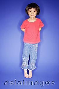 Asia Images Group - Young girl jumping, blue background