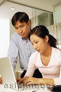 Asia Images Group - Young couple using laptop at home