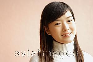 Asia Images Group - Young woman looking at camera, portrait