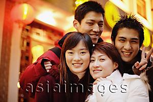Asia Images Group - Young adults looking at camera, smiling