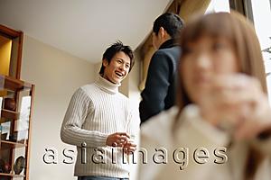 Asia Images Group - Young adults at a cafe, talking