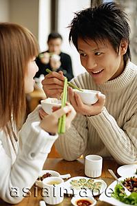 Asia Images Group - Couple eating at a restaurant