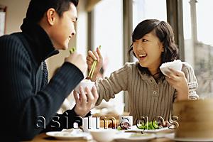 Asia Images Group - Young couple eating at a Chinese restaurant