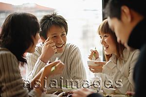 Asia Images Group - Group of friends eating at a Chinese restaurant