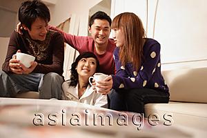 Asia Images Group - Friends sitting around at home