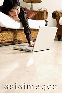 Asia Images Group - Woman at home, using laptop