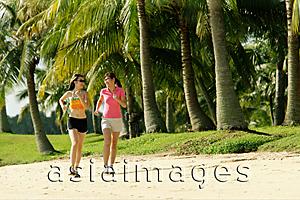 Asia Images Group - Women jogging along beach