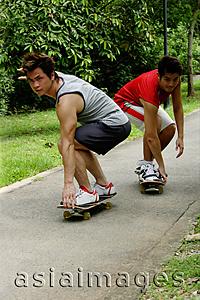 Asia Images Group - Two guys on skateboards