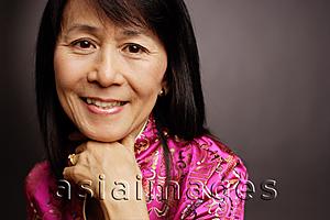 Asia Images Group - Portrait of a mature woman, hand on chin