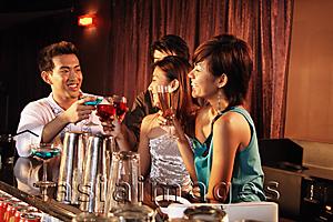 Asia Images Group - Couples having drinks at bar
