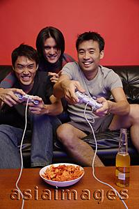 Asia Images Group - Young men playing with video games