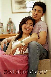 Asia Images Group - Woman leaning against man, looking at camera