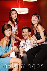 Asia Images Group - Young adults, holding drinks and smiling at camera