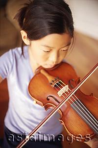 Asia Images Group - Young girl playing the violin