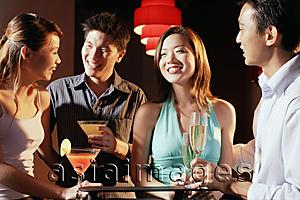 Asia Images Group - Couples in night club, holding drinks