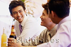 Asia Images Group - Young men having drinks