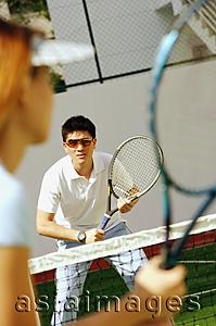 Asia Images Group - Woman holding tennis racket, playing tennis