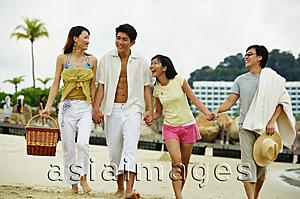 Asia Images Group - Couples on beach, walking hand in hand