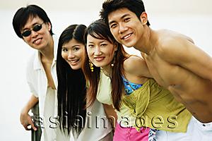 Asia Images Group - Couples standing in a row, looking at camera