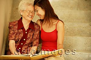 Asia Images Group - Grandmother with granddaughter, face to face