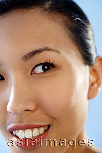 Asia Images Group -  Close up of woman's face, looking away