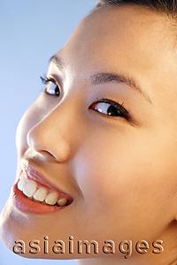 Asia Images Group - Woman looking at camera, sideways glance