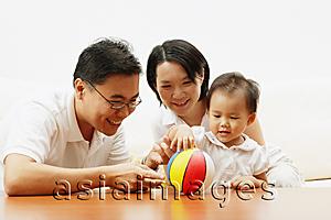Asia Images Group - Family with one child, daughter playing with ball