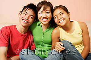 Asia Images Group - Mother with son and daughter, looking at camera, smiling