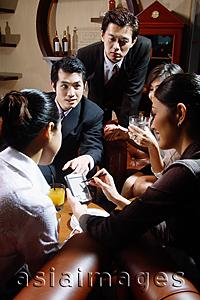 Asia Images Group - Group of executives having a discussion over drinks