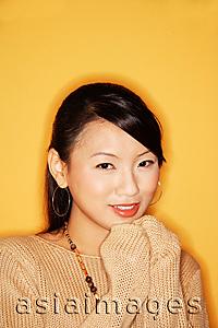 Asia Images Group - Young woman looking at camera, smiling