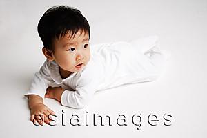 Asia Images Group - Baby boy lying on front, looking away