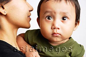 Asia Images Group - Mother carrying baby boy, boy looking forward