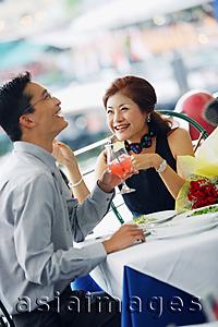Asia Images Group - Couple having lunch, laughing