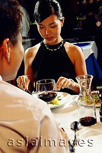 Asia Images Group - Couple having dinner, over the shoulder view