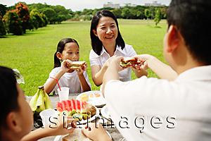 Asia Images Group - Family having a picnic in park