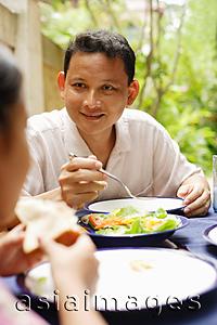 Asia Images Group - Man eating, portrait