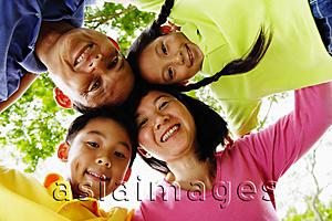 Asia Images Group - Family with two children, looking down at camera