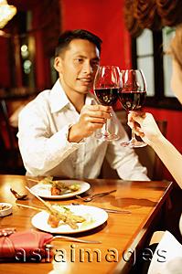 Asia Images Group - Couple toasting with wine at restaurant