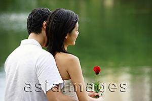 Asia Images Group - Couple embracing, rearview