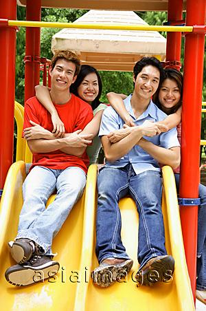 Asia Images Group - Young adults in playground, smiling at camera, portrait