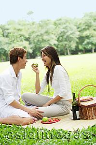 Asia Images Group - Couple having picnic in park