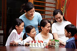 Asia Images Group - Family celebrating grandmothers birthday