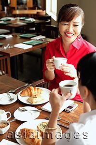 Asia Images Group - Two women having tea at cafe