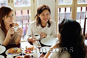 Asia Images Group - Women sitting in cafe, having tea