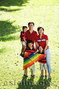 Asia Images Group - Family with three boys, standing on field, portrait